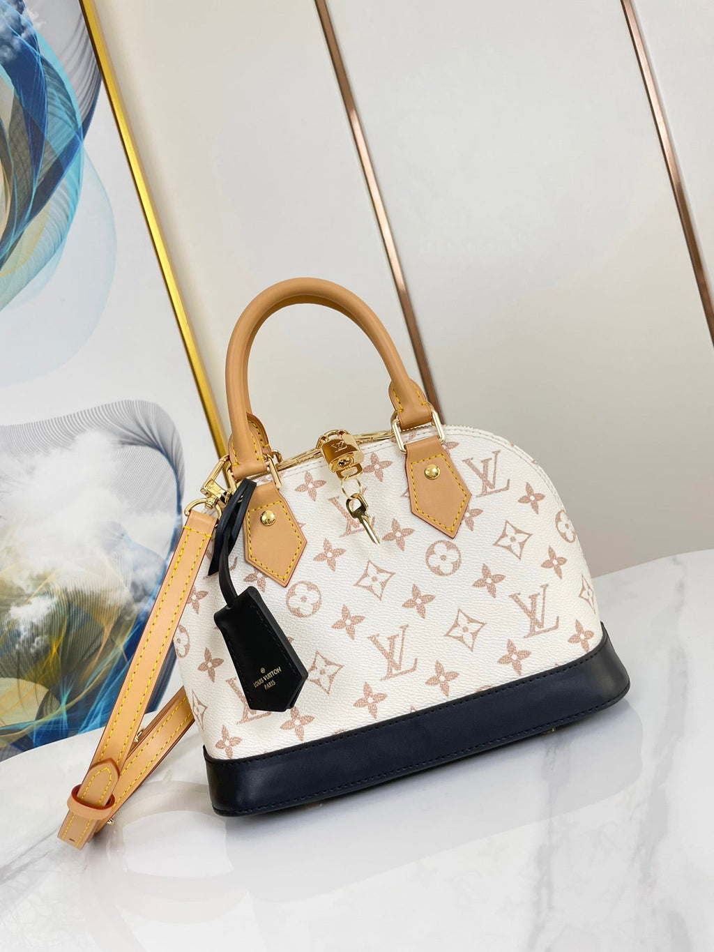 ALMA BB 25 EN TOILE DUNE MONOGRAMME BLANC QUINCAILLERIE DORÉ