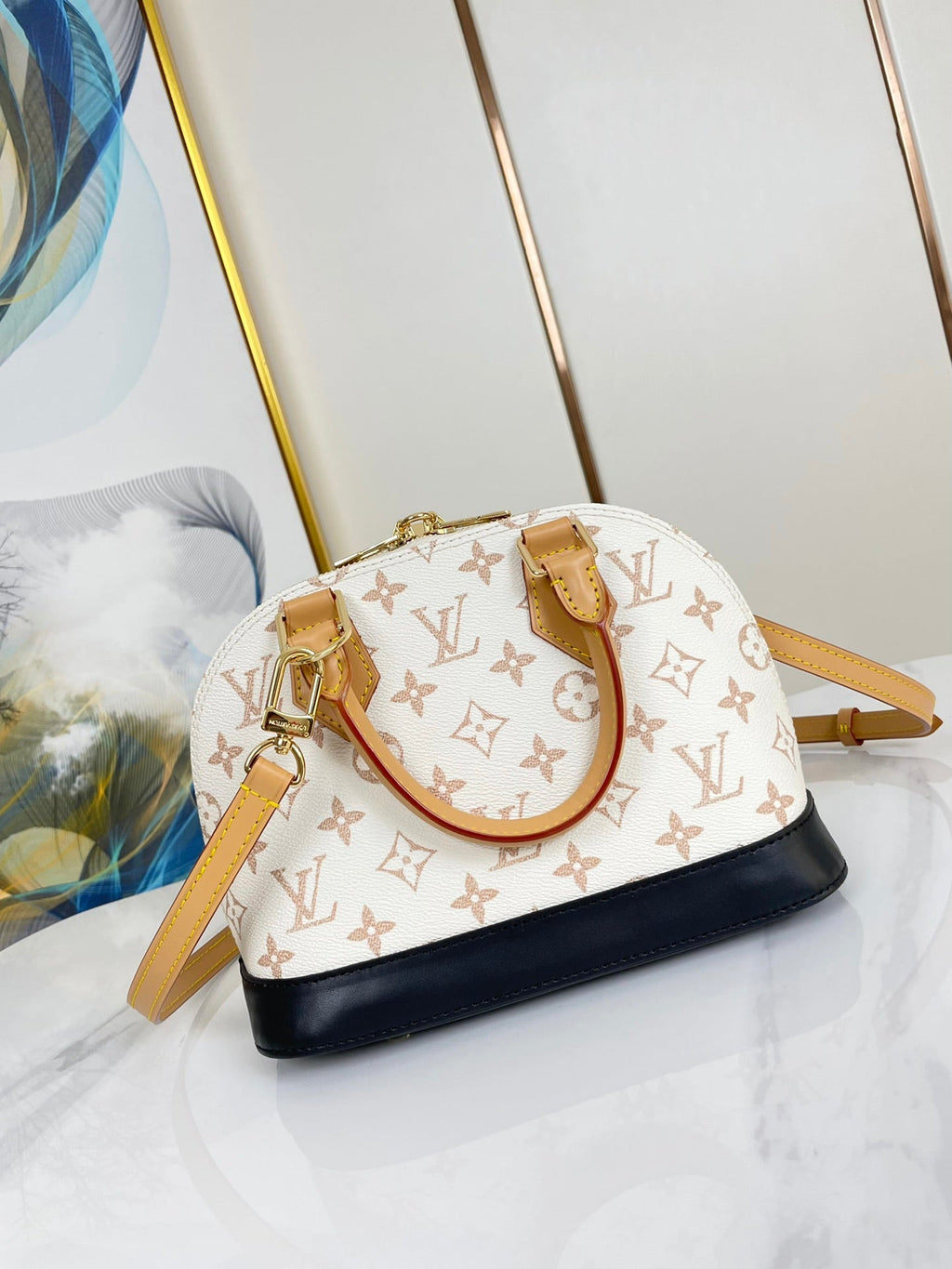 ALMA BB 25 EN TOILE DUNE MONOGRAMME BLANC QUINCAILLERIE DORÉ