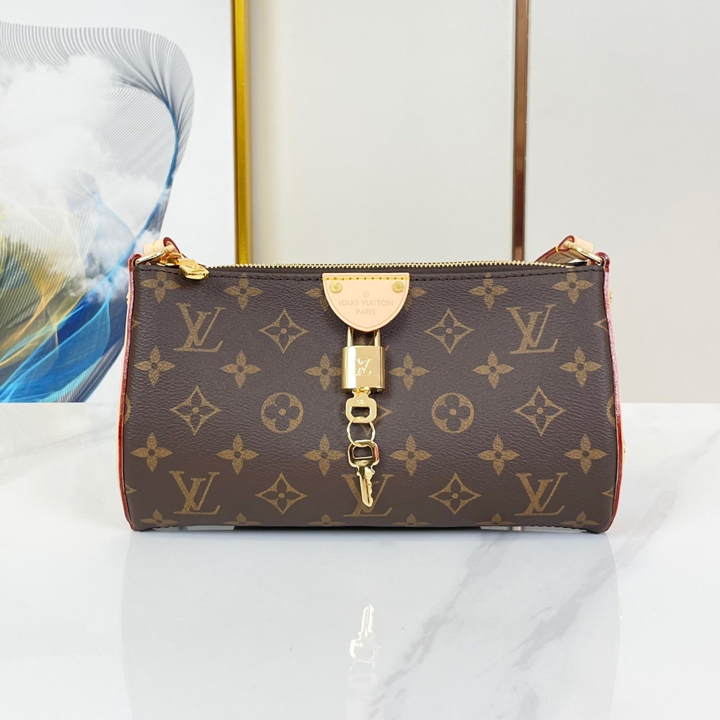 POCHETTE TIRETTE 22 EN TOILE MONOGRAMME MARRON BOUCLE DOREE