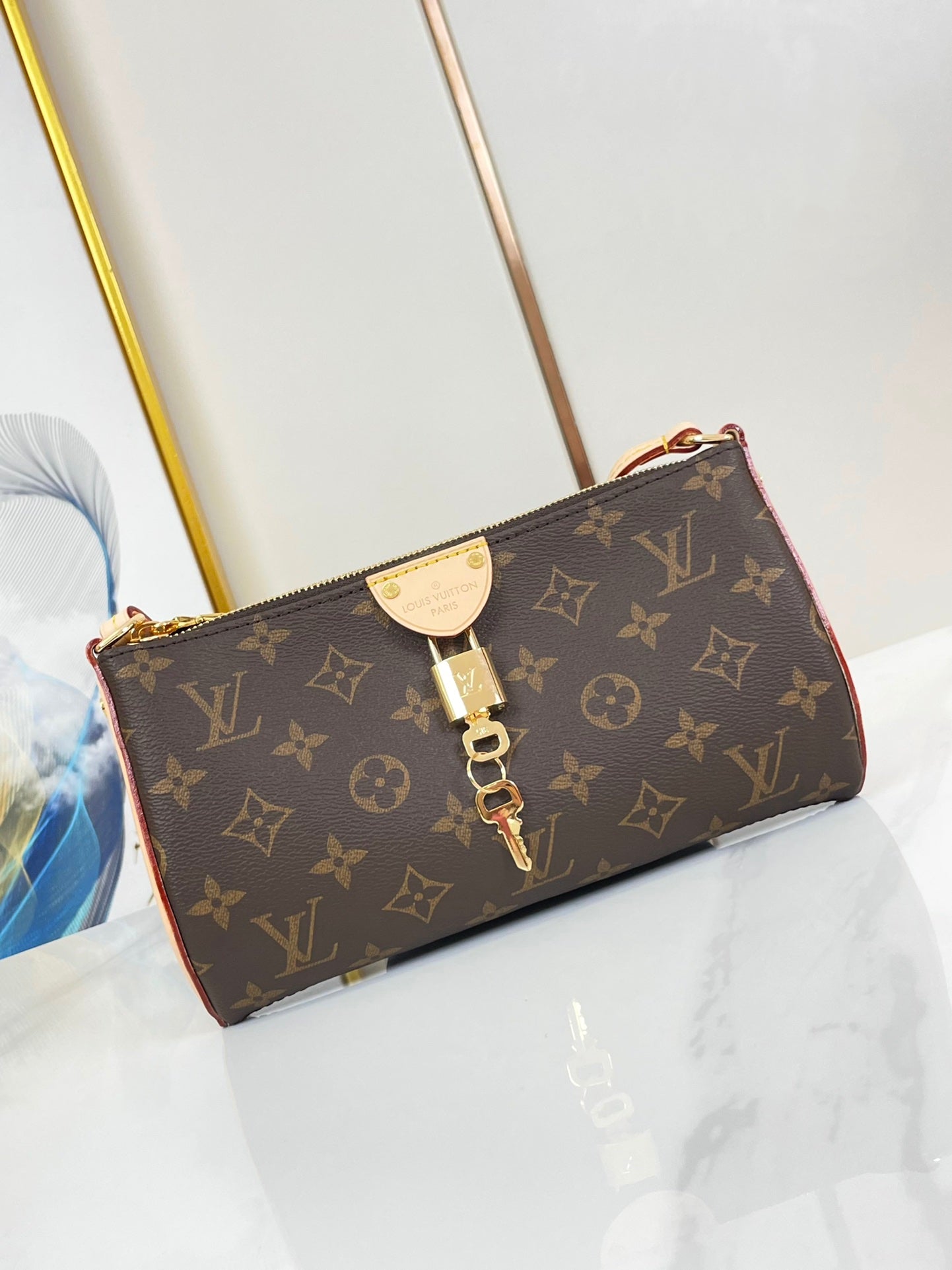 POCHETTE TIRETTE 22 EN TOILE MONOGRAMME MARRON BOUCLE DOREE