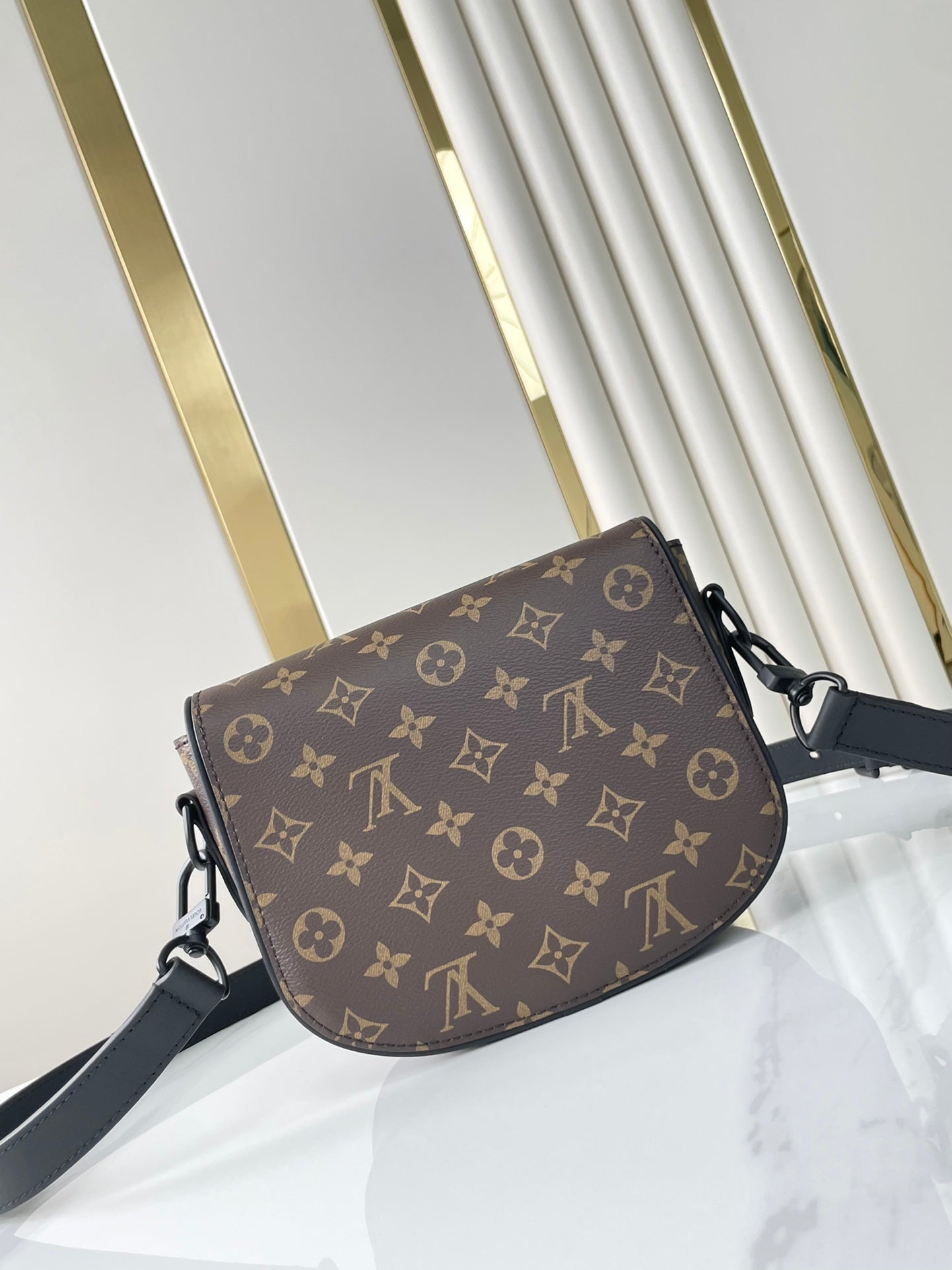 MONTSOURIS MESSENGER PM 20 EN TOILE MONOGRAMME MARRON
