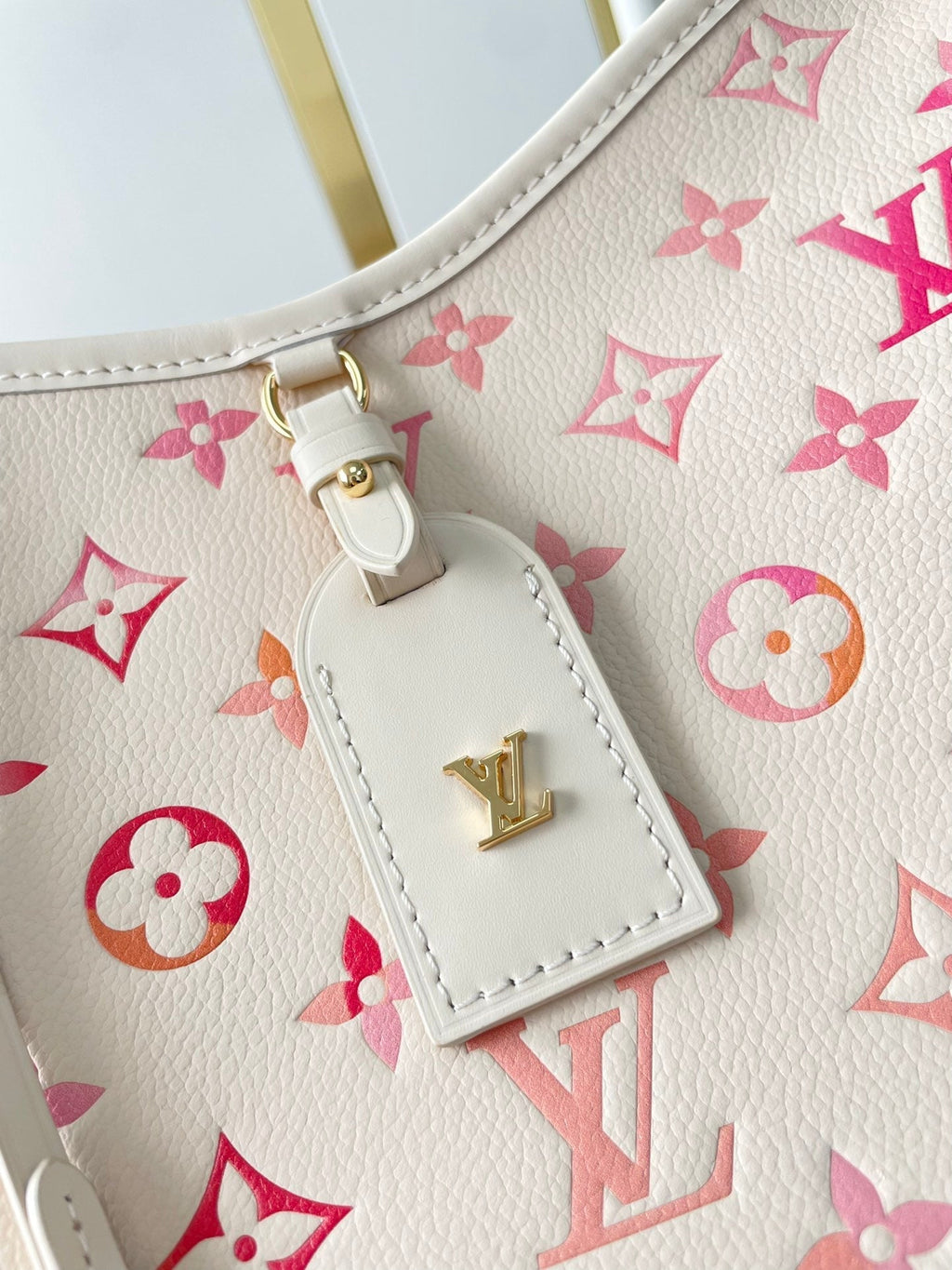 CARRYALL PM 29 EN CUIR MONOGRAMME EMPREINTE SUNRISE AQUARELLE