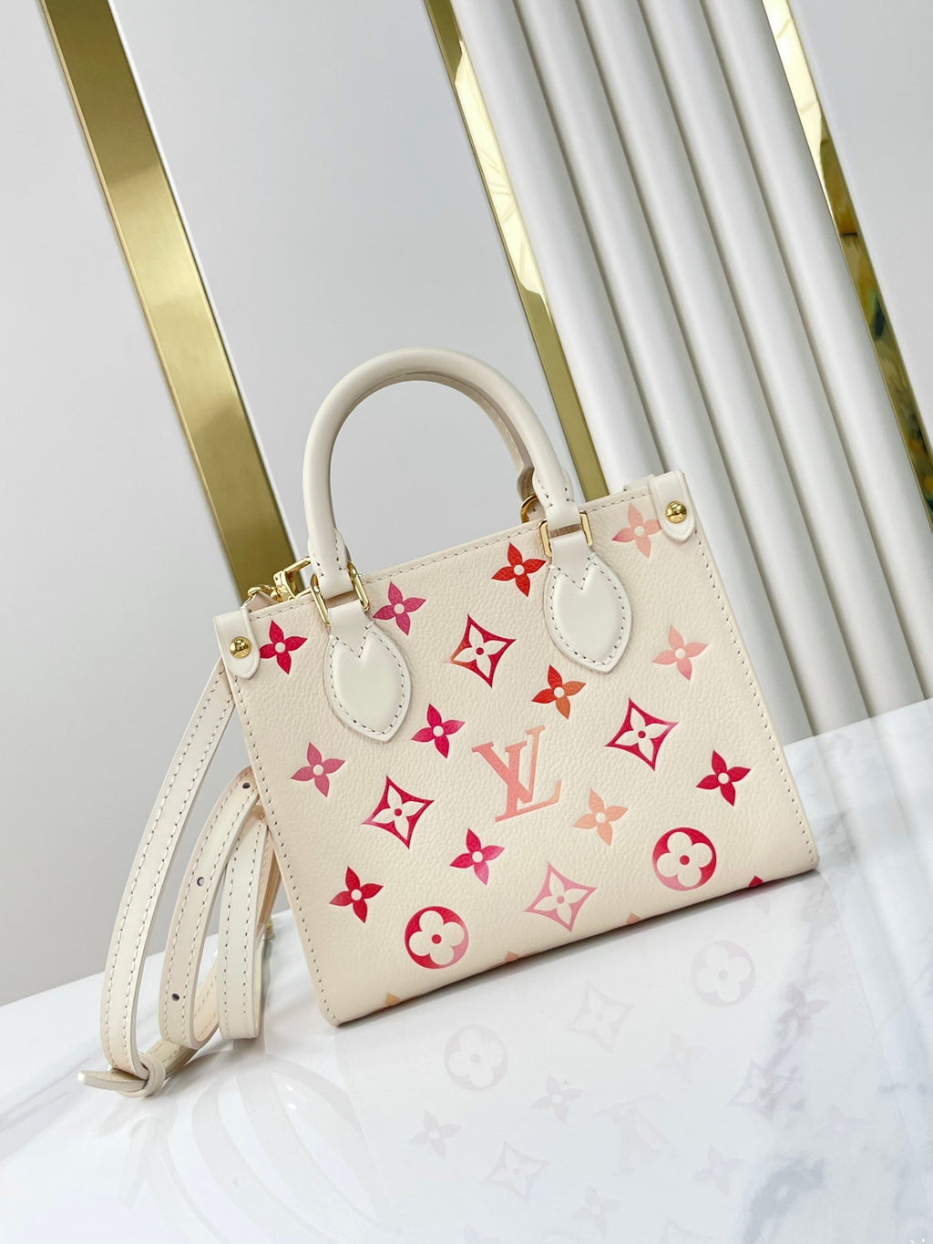 ONTHEGO BB 18 EN CUIR MONOGRAMME EMPREINTE SUNRISE AQUARELLE