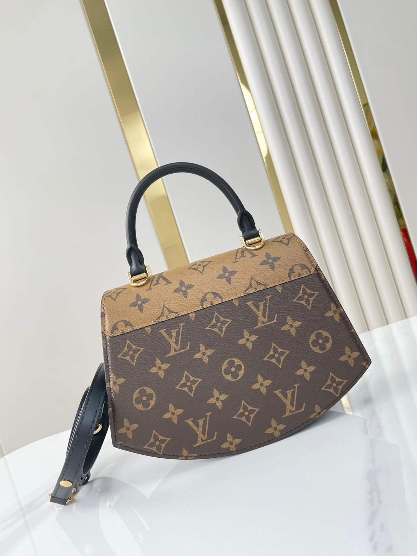 TILSITT 24 EN TOILE MARRON MONOGRAMME ET MONOGRAMME INVERSE BOUCLE DOREE
