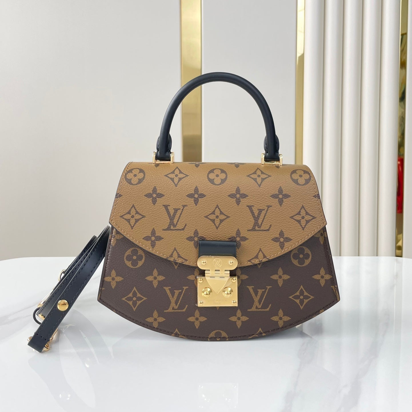 TILSITT 24 EN TOILE MARRON MONOGRAMME ET MONOGRAMME INVERSE BOUCLE DOREE
