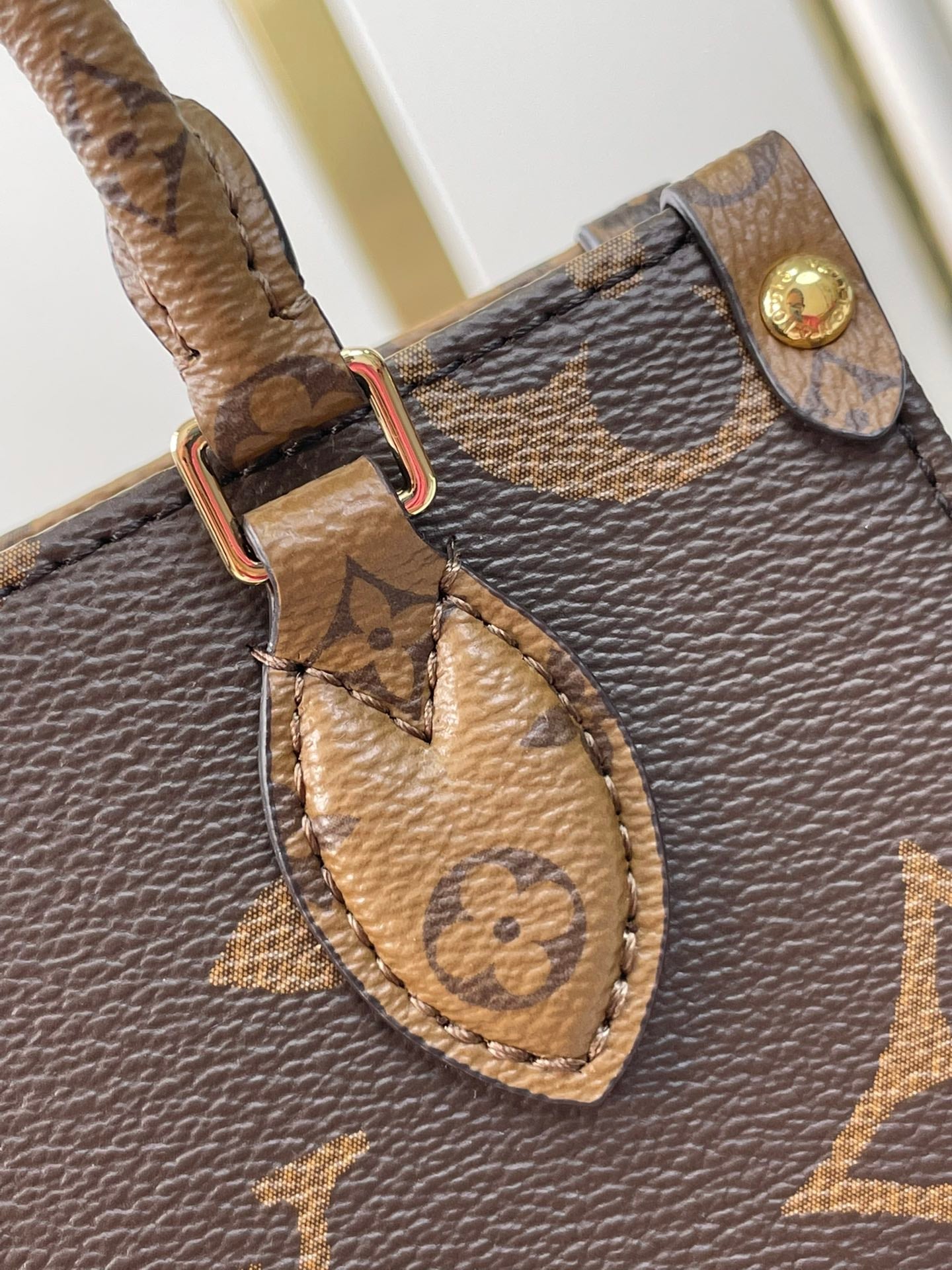 ONTHEGO BB 18 EN TOILE MONOGRAMME MARRON ET MONOGRAMME INVERSE