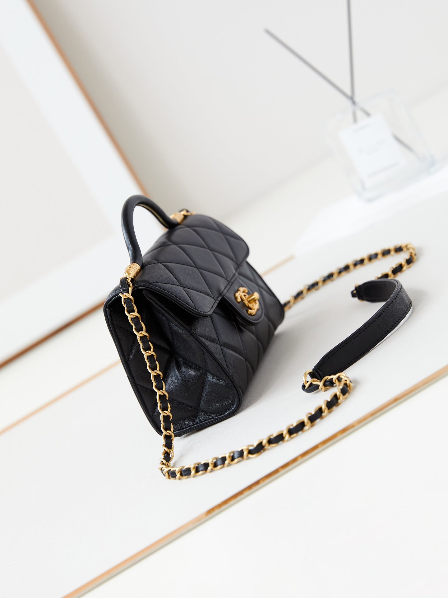 24A FLAP BAG WITH TOP HANDLE 18CM BLACK LAMBSKIN GOLD HARDWARE
