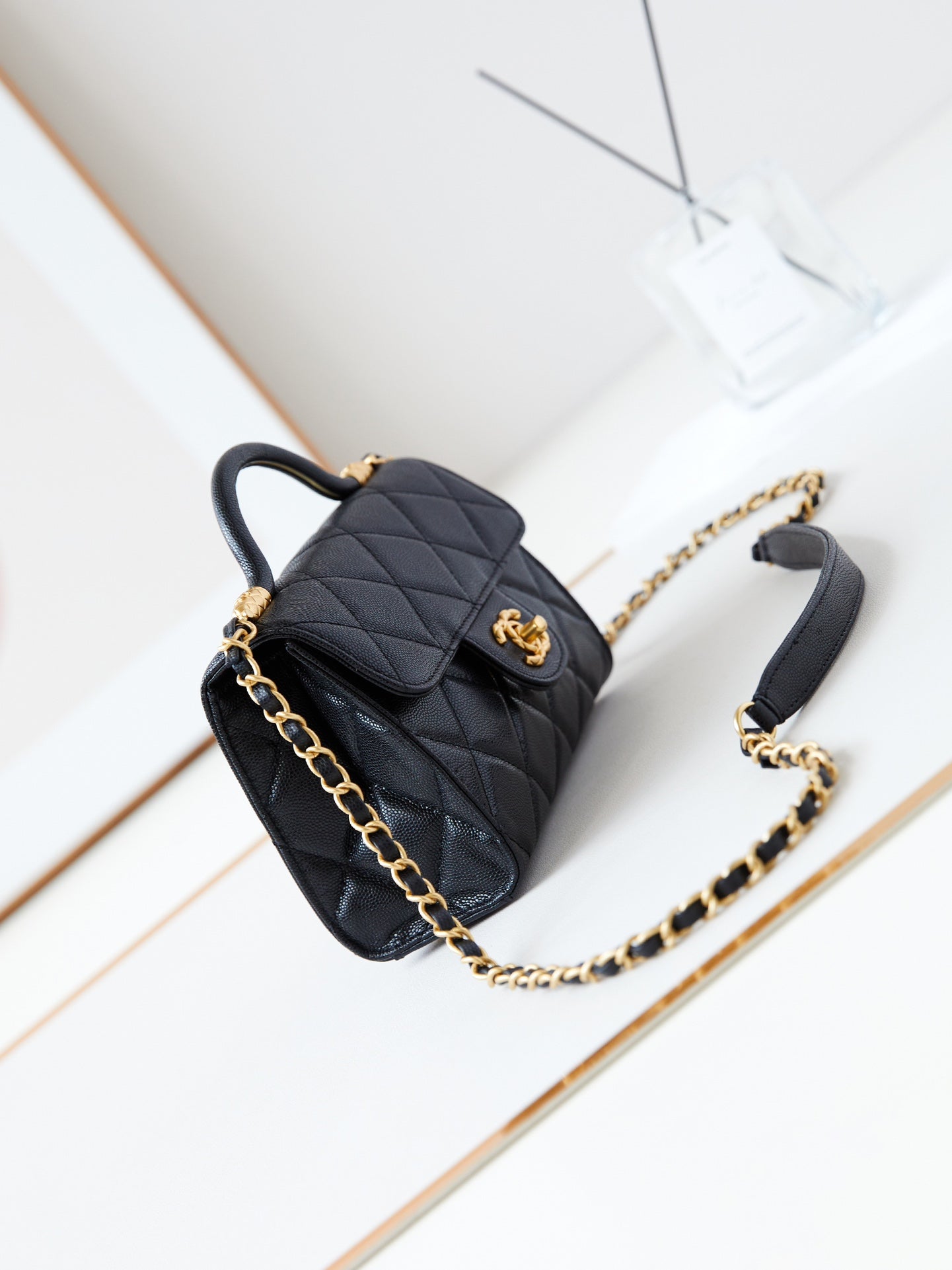 24A FLAP BAG WITH TOP HANDLE 18CM BLACK CAVIAR GOLD HARDWARE