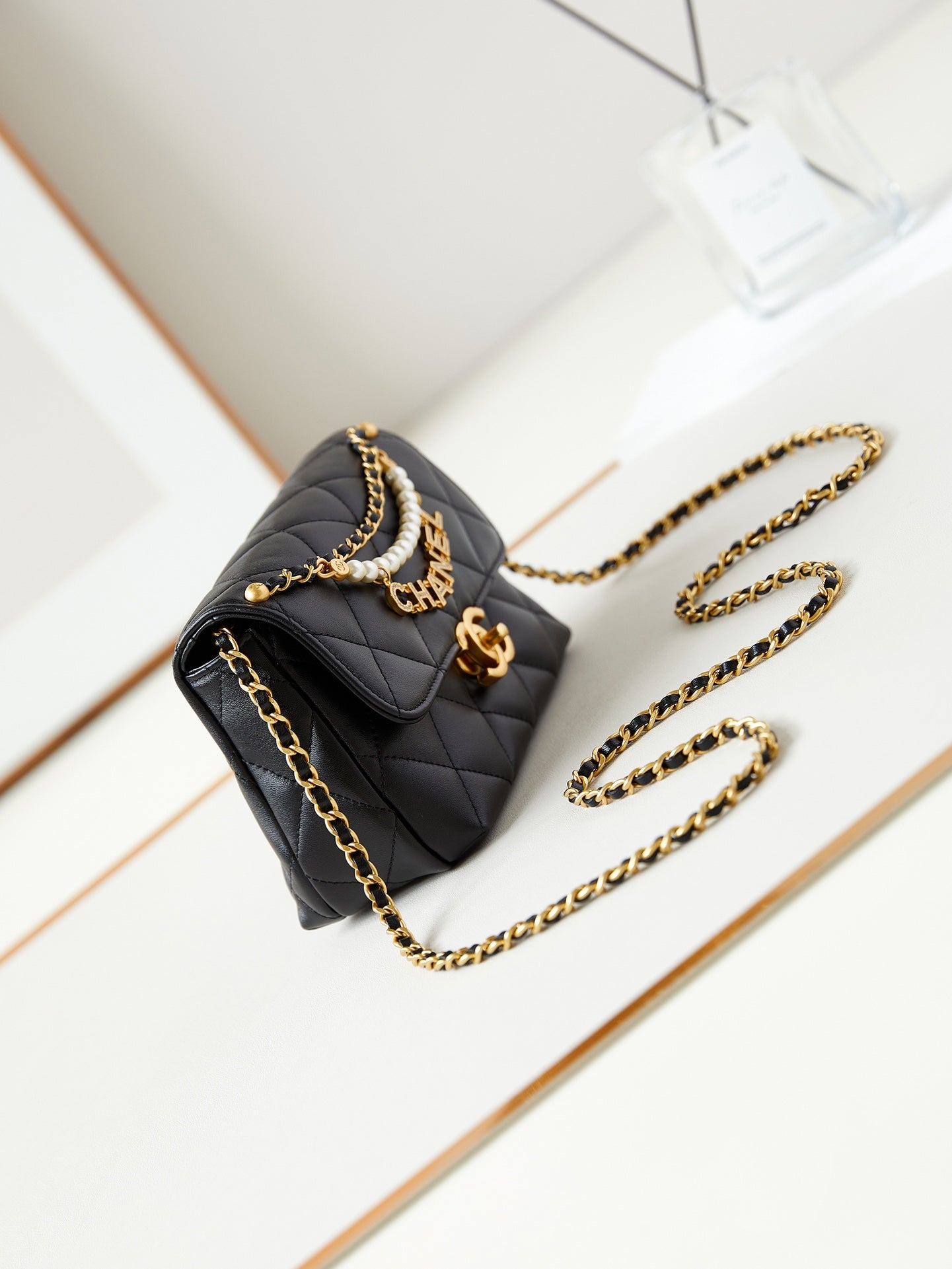 24A MINI FLAP BAG 20CM BLACK LAMBSKIN PEARL AND GOLD HARDWARE
