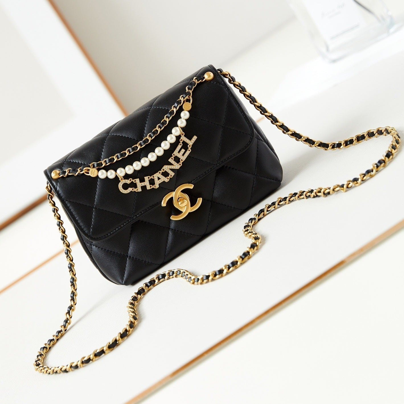24A MINI FLAP BAG 20CM BLACK LAMBSKIN PEARL AND GOLD HARDWARE