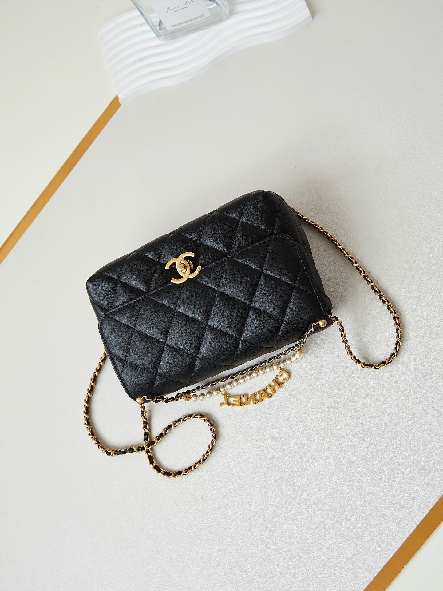 24A SMALL FLAP BAG 23CM BLACK LAMBSKIN PEARL AND GOLD HARDWARE