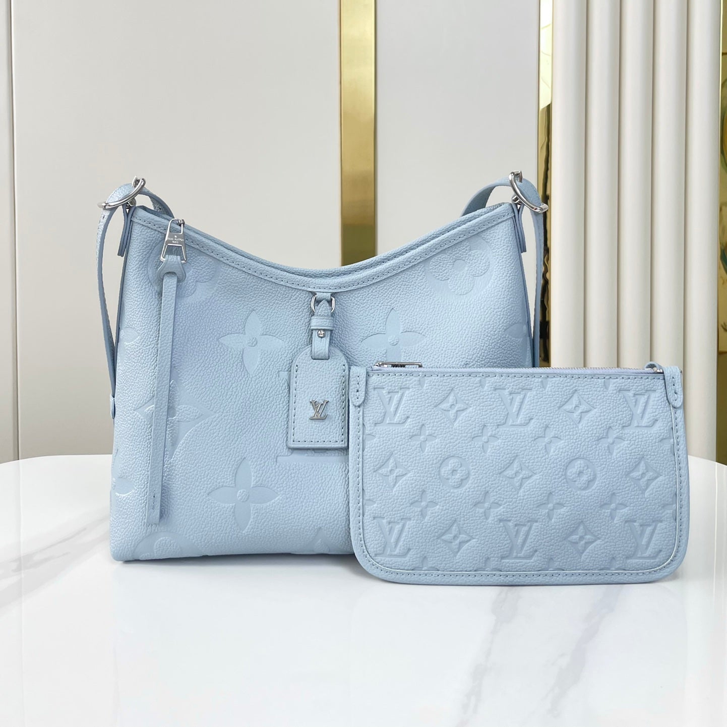 CARRYALL PM 29 EN CUIR EMPREINTE MONOGRAMME BLEU BEAU