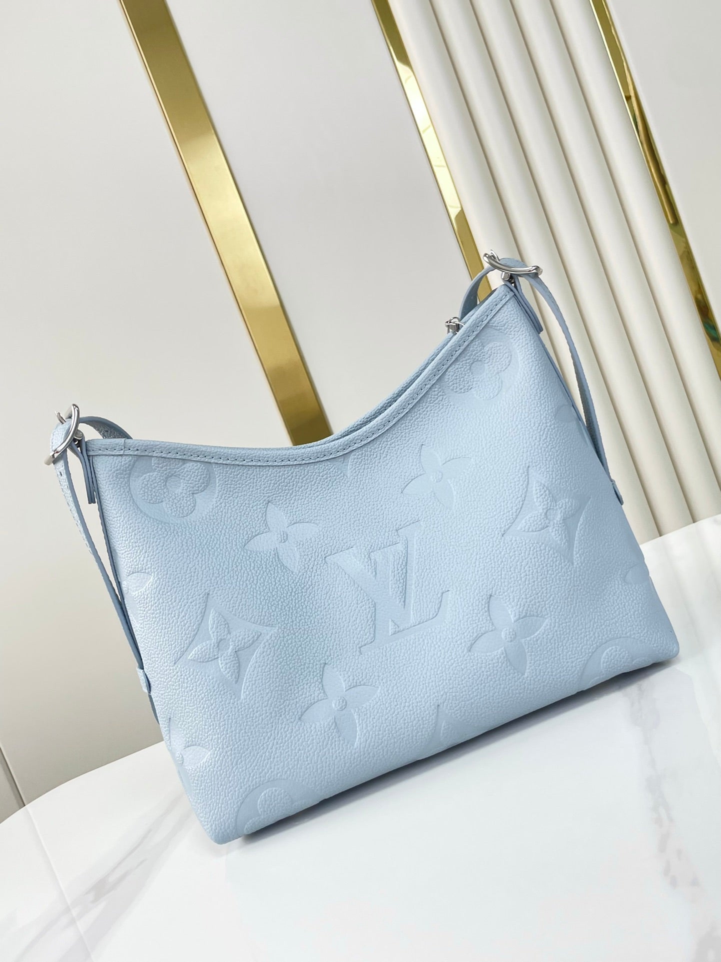 CARRYALL PM 29 EN CUIR EMPREINTE MONOGRAMME BLEU BEAU