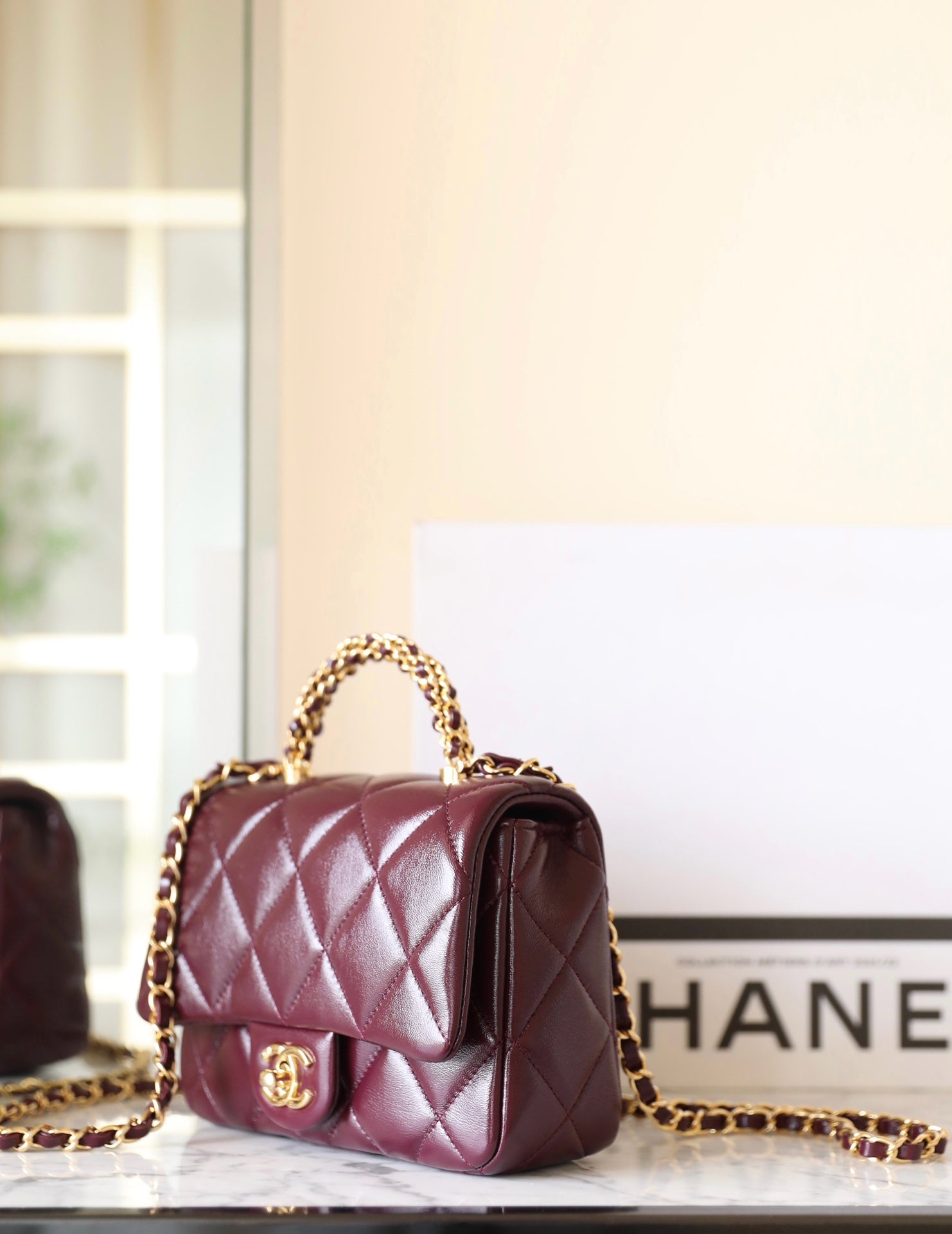 24B MINI FLAP BAG WITH TOP HANDLE 19CM BURGUNDY LAMBSKIN