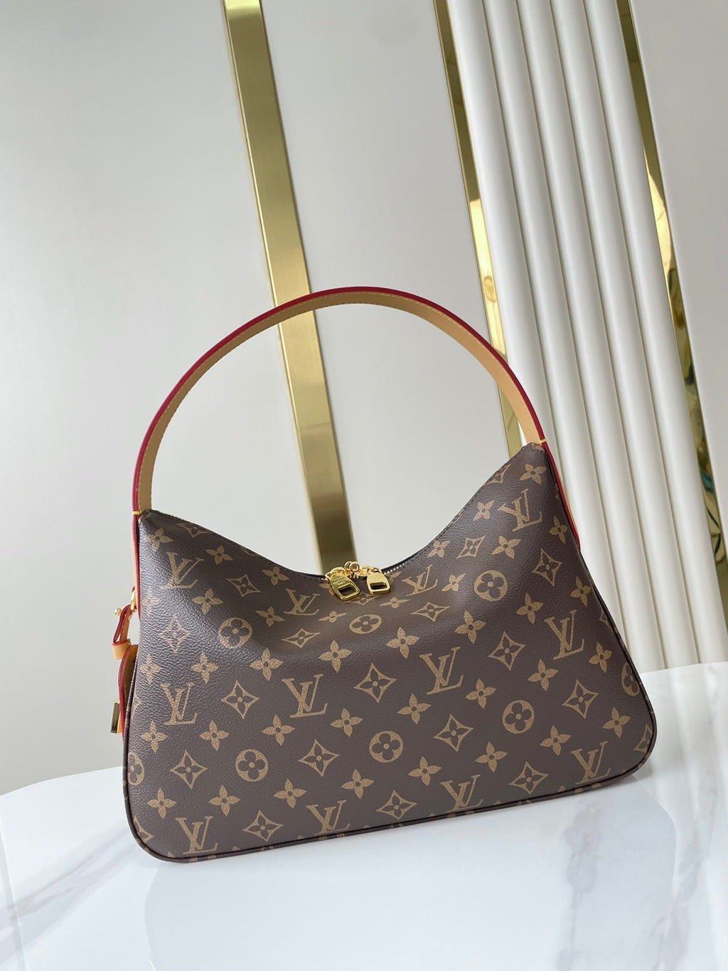 SLOUCHY PM 33 EN TOILE MONOGRAMME MARRON