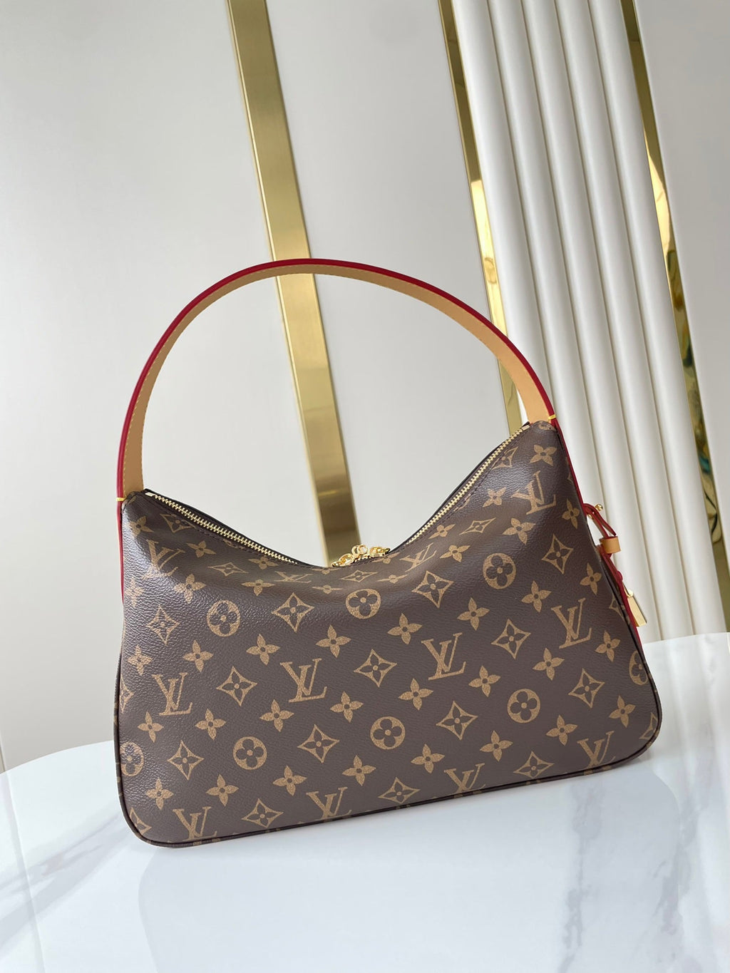 SLOUCHY PM 33 EN TOILE MONOGRAMME MARRON
