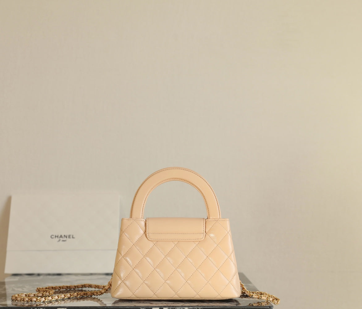 SAC CABAS KELLY CC 24K NANO 19CM EN CUIR D'AGNEAU VERNI BEIGE