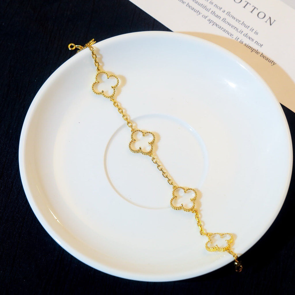BRACELET EN OR ROSE ET CRISTAL DE ROCHE À 5 MOTIFS TRÈFLE