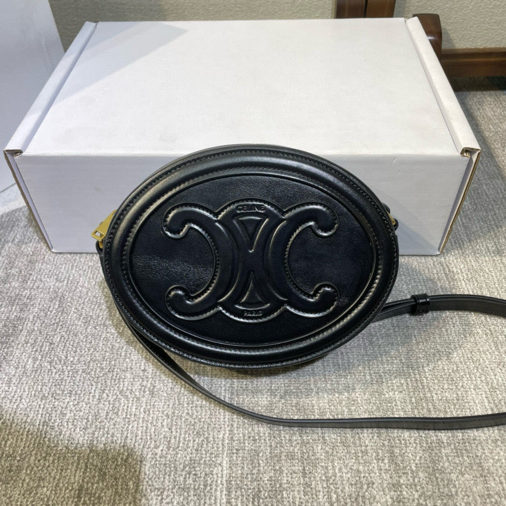 SAC OVALE 20 EN CUIR DE VEAU LISSE NOIR CANNELLE