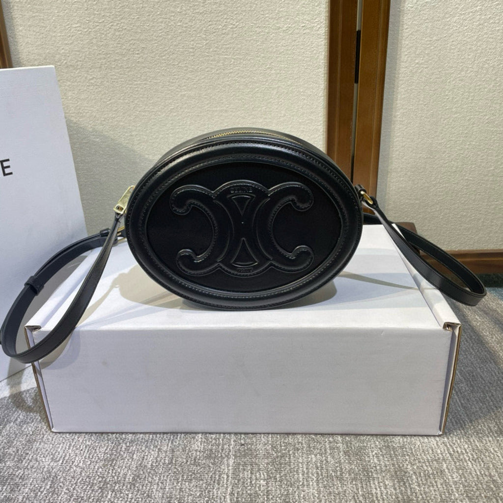 SAC OVALE 20 EN CUIR DE VEAU LISSE NOIR CANNELLE
