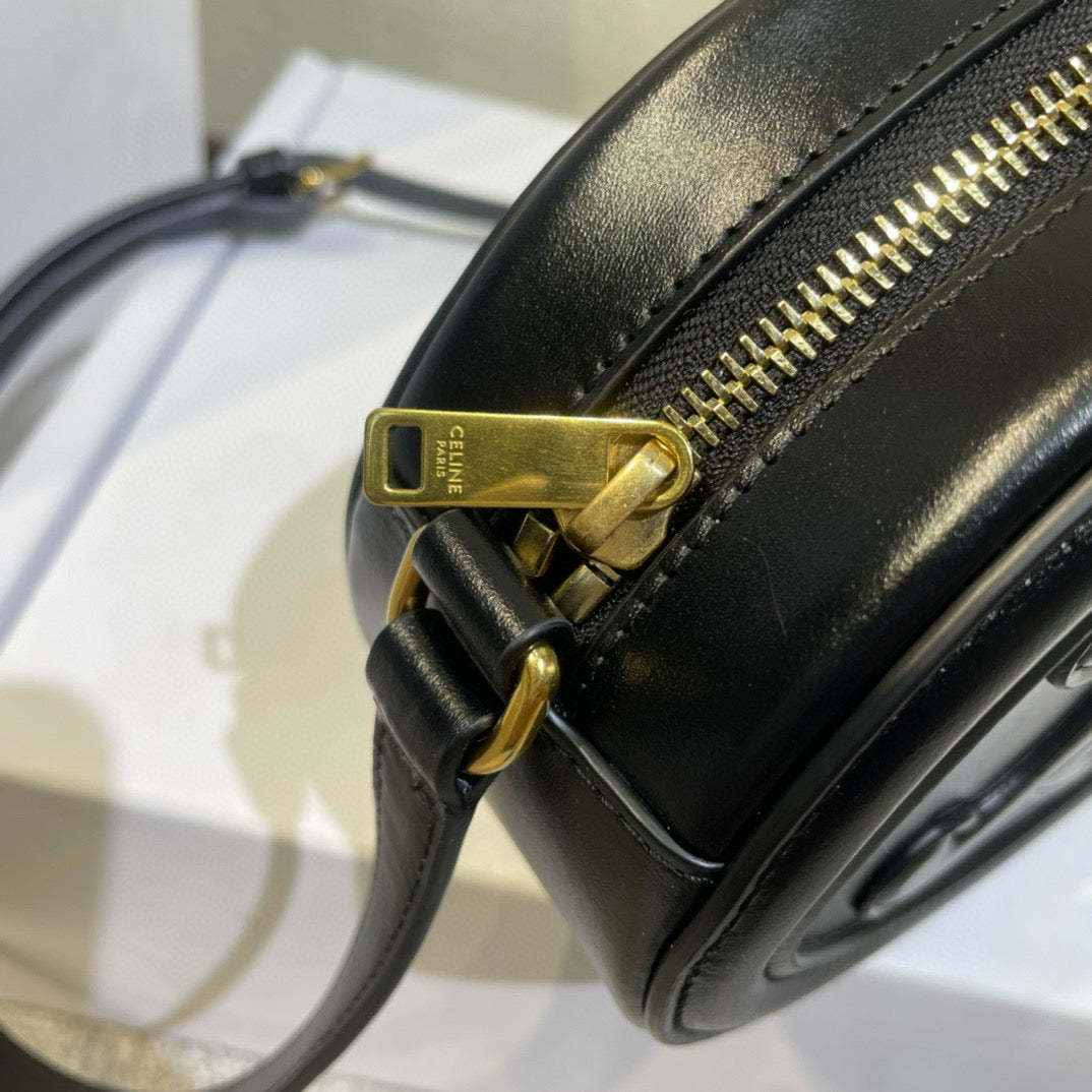 SAC OVALE 20 EN CUIR DE VEAU LISSE NOIR CANNELLE