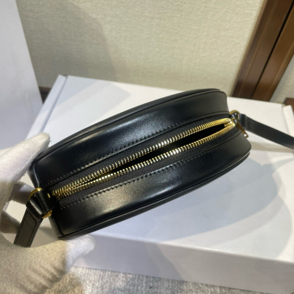 SAC OVALE 20 EN CUIR DE VEAU LISSE NOIR CANNELLE