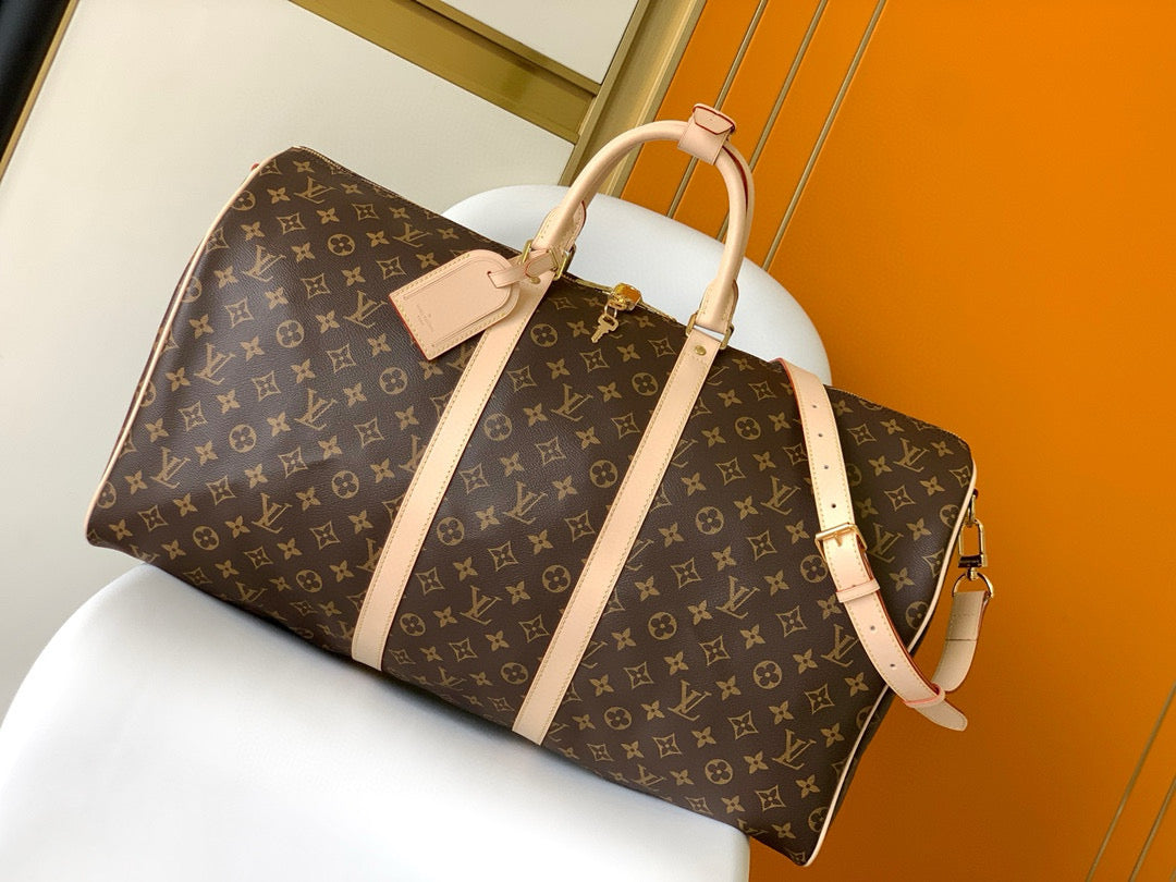 Sac bandoulière Louis Vuitton Keepall 55 en toile monogrammée marron et métal doré