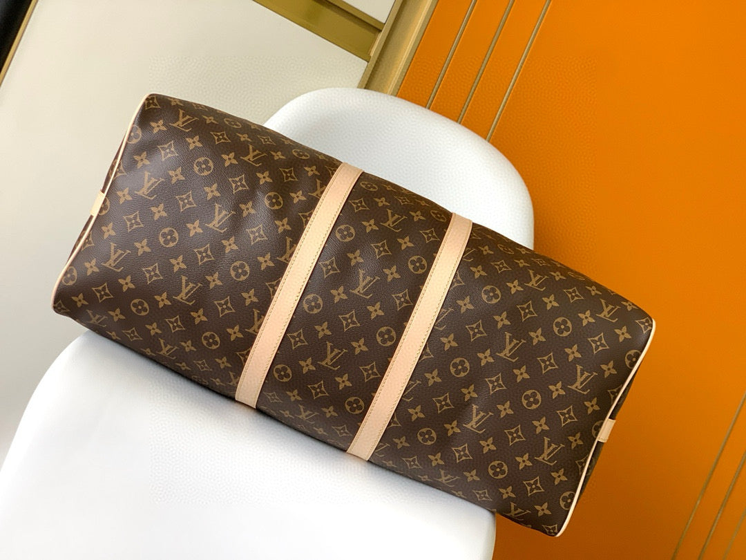 Sac bandoulière Louis Vuitton Keepall 55 en toile monogrammée marron et métal doré