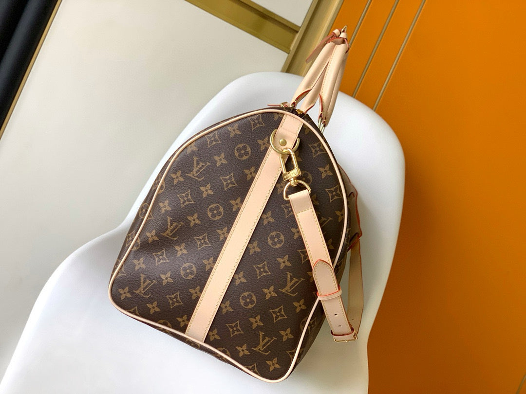 Sac bandoulière Louis Vuitton Keepall 55 en toile monogrammée marron et métal doré