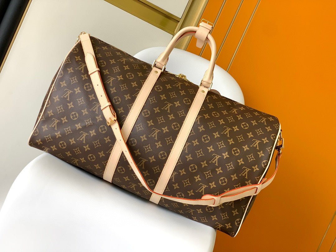 Sac bandoulière Louis Vuitton Keepall 55 en toile monogrammée marron et métal doré