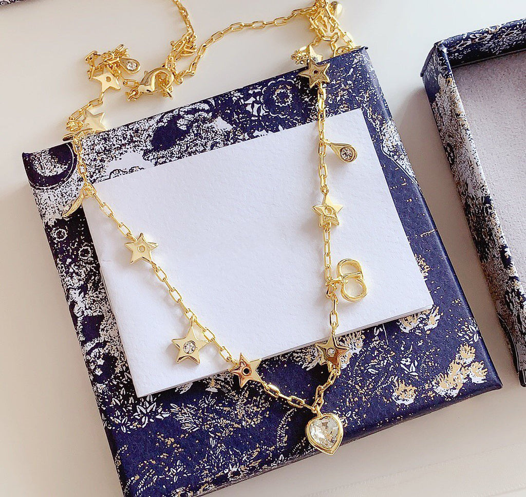 COLLIER CD STAR LOVE AVEC LE MÊME MATÉRIAU