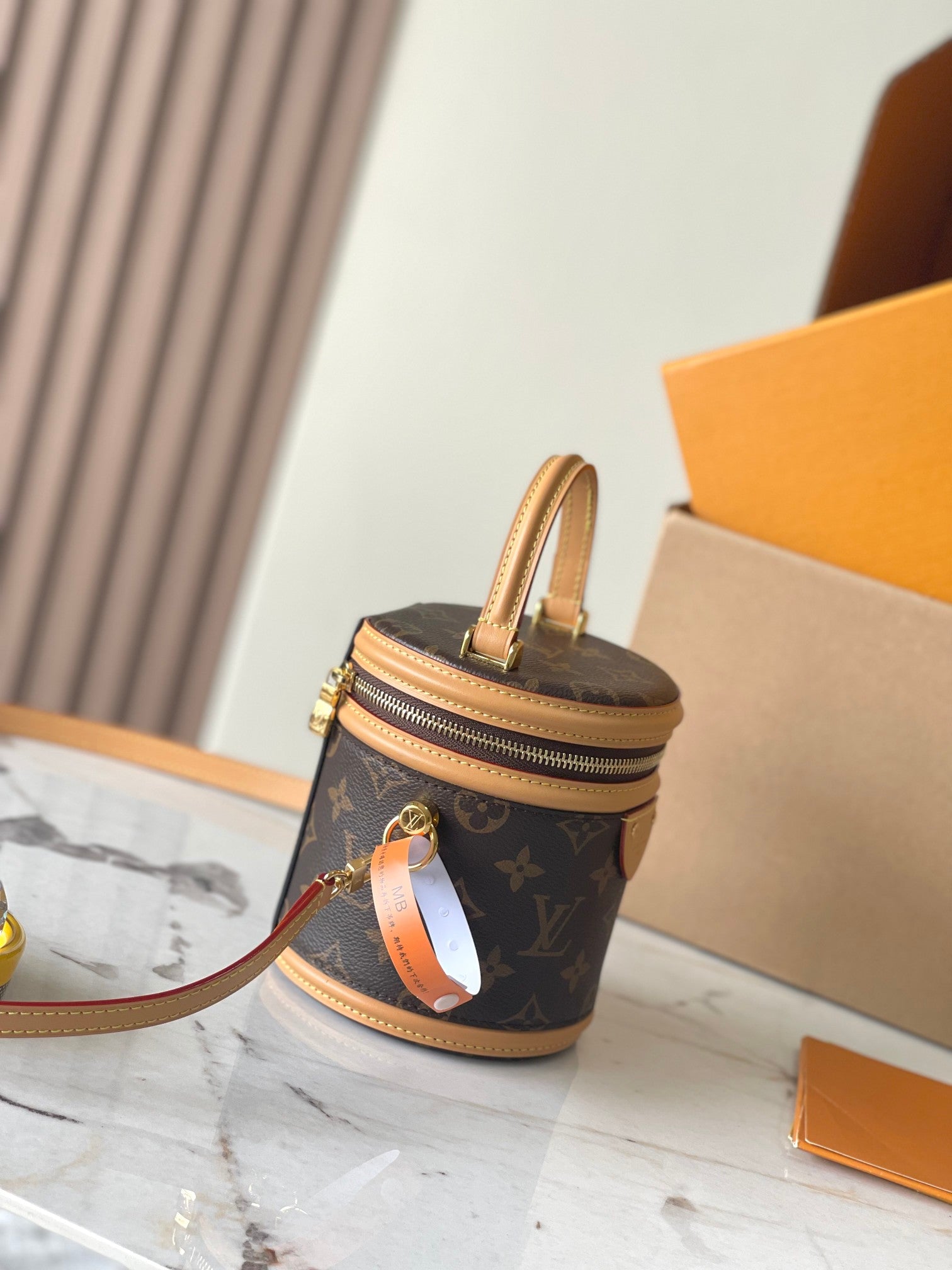 CANNES NANO 14 EN TOILE MONOGRAMME MARRON ET GARNITURES EN CUIR