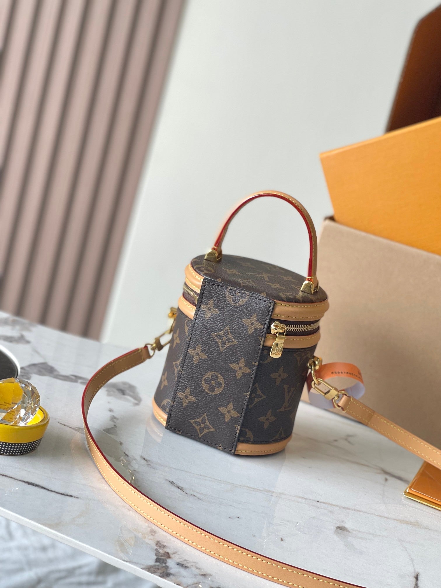 CANNES NANO 14 EN TOILE MONOGRAMME MARRON ET GARNITURES EN CUIR