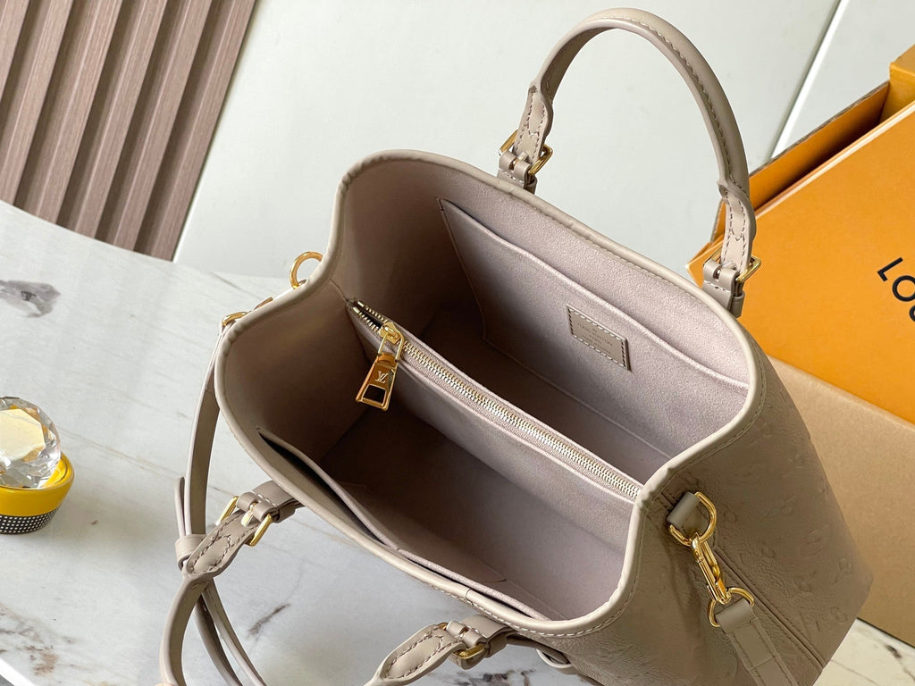 SAC BABYLONE 31 EN CUIR MONOGRAMME TOURTERELLE EMPREINTE