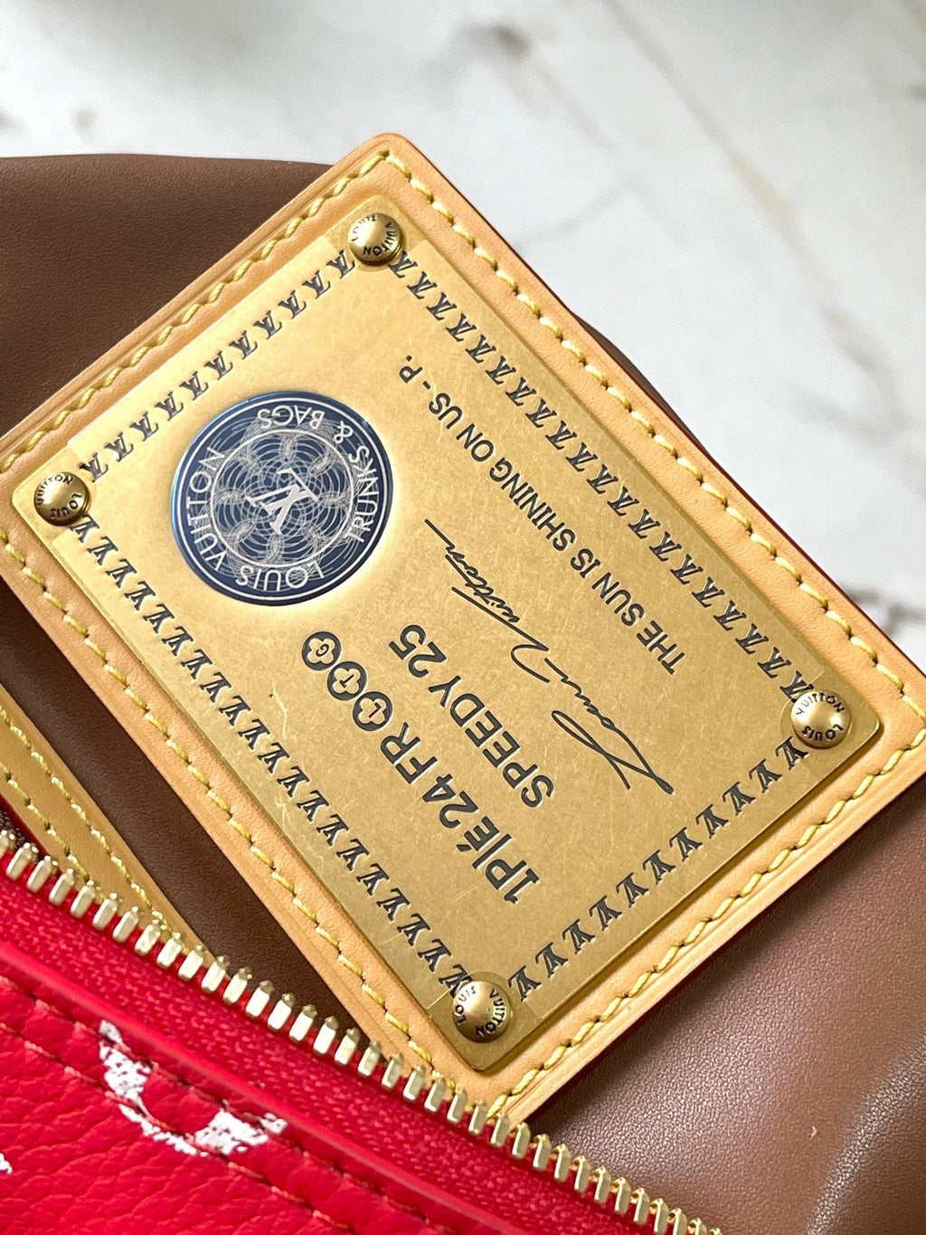 SPEEDY P9 BANDOULIÈRE 25 EN TOILE MONOGRAMME ROUGE QUINCAILLERIE DORÉ