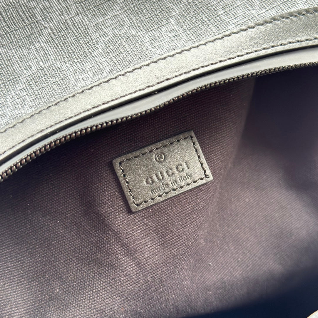 SAC À DOS 44 EN TOILE MONOGRAMME GRISE ET BORDURE EN CUIR NOIR
