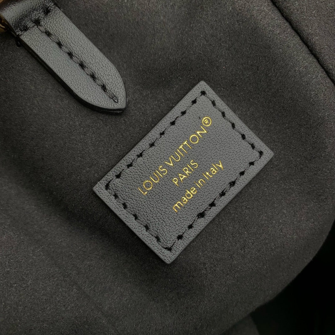 Malle Noé 23 en toile inversée monogrammée marron et quincaillerie dorée
