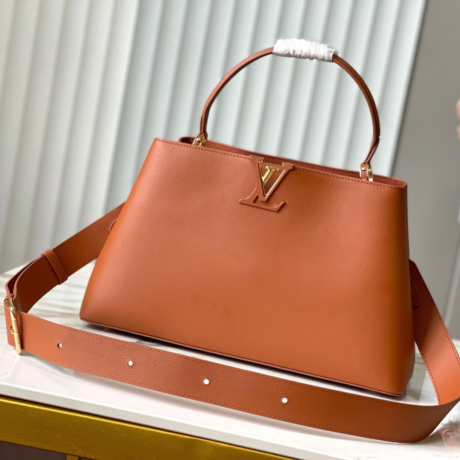 CAPUCINES GM 38CM CUIR TAURILLON MARRON ORANGE
