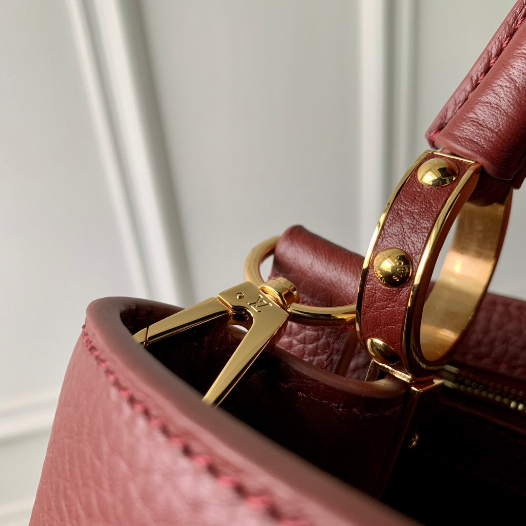 CAPUCINES MM 31,5 CUIR TAURILLON BORDEAUX QUINCAILLERIE DORÉ