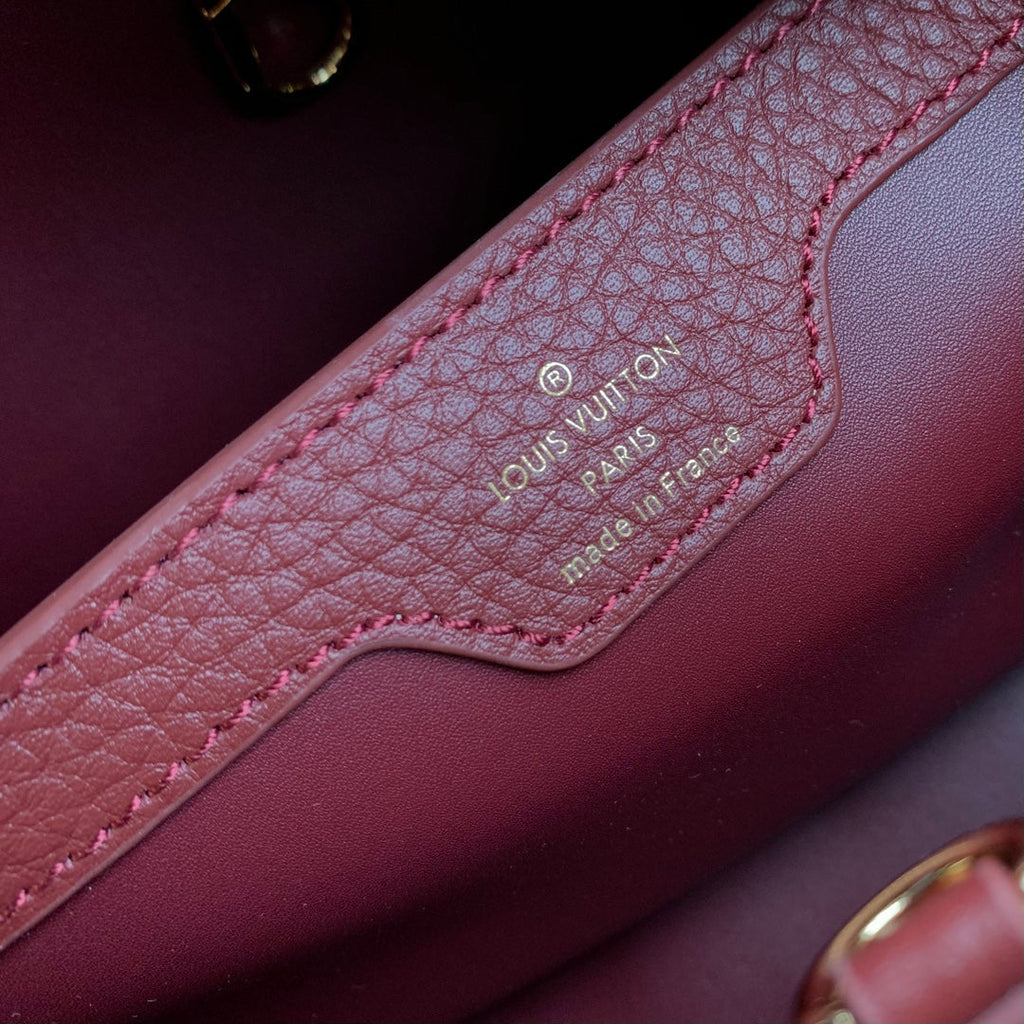 CAPUCINES MM 31.5 BURGUNDY TAURILLON LEATHER GOLD HARDWARE