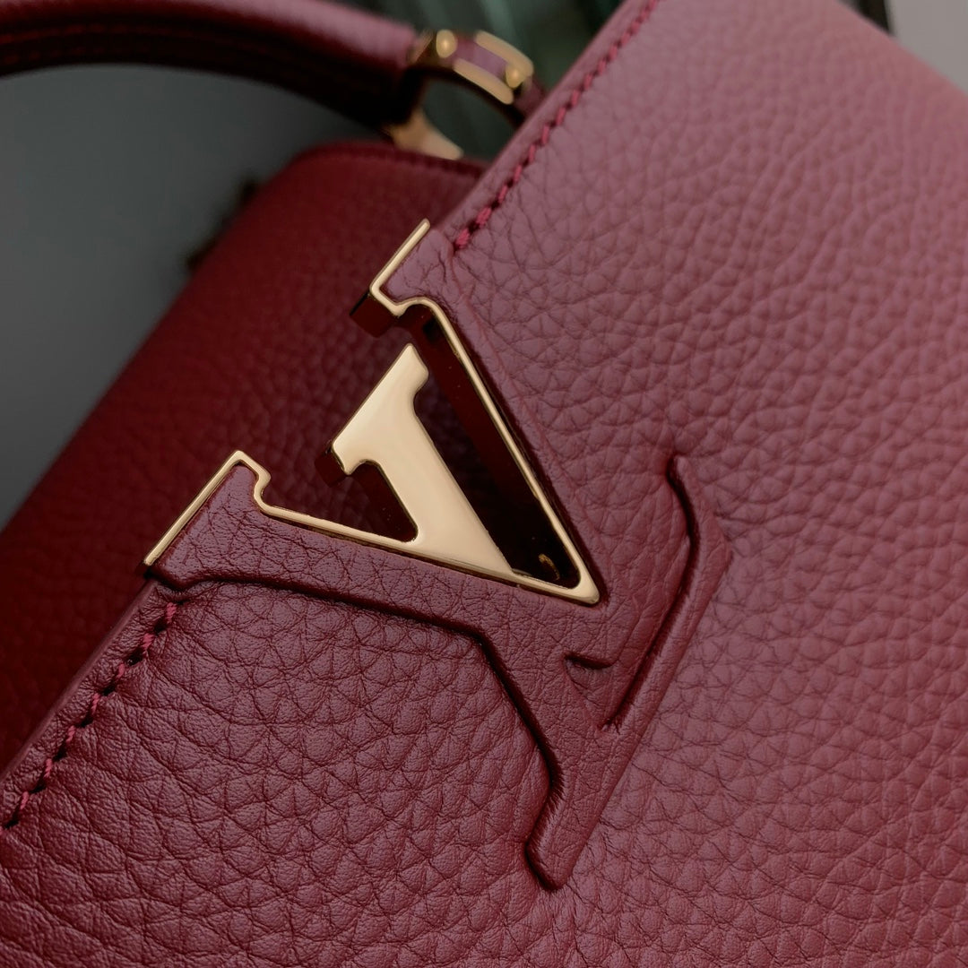 CAPUCINES MM 31.5 BURGUNDY TAURILLON LEATHER GOLD HARDWARE