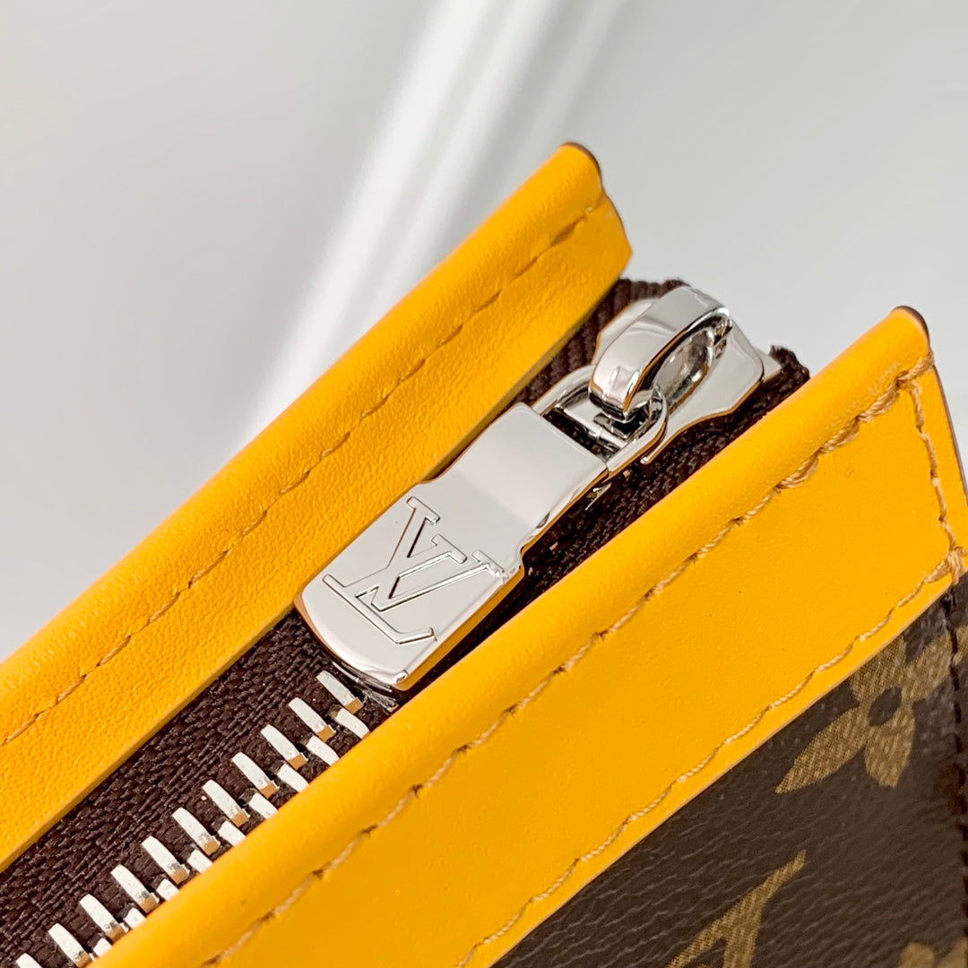 Portefeuille portable Gaston 18 pouces en toile monogrammée marron et cuir de veau jaune mélangé