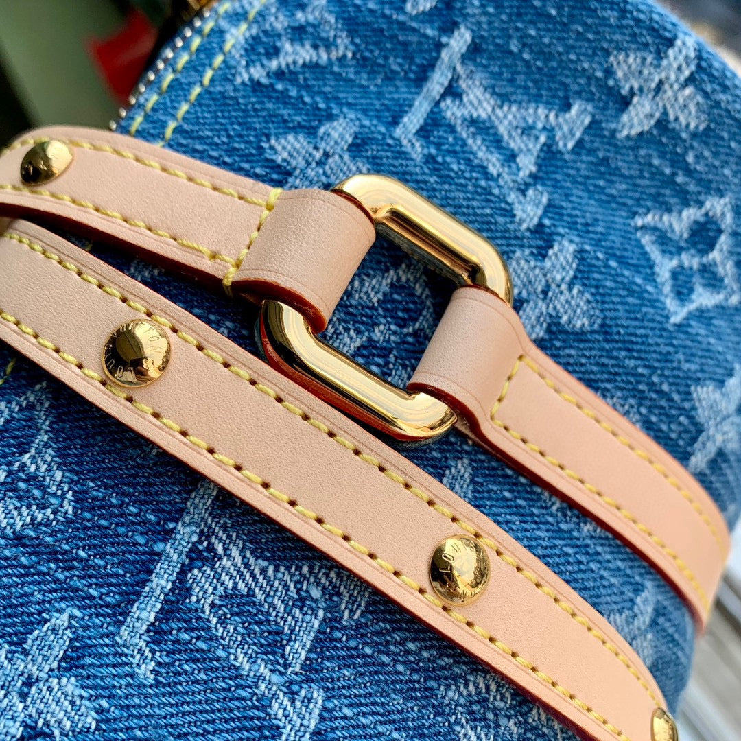 PAPILLON 27 EN DENIM BLEU MONOGRAMME QUINCAILLERIE DORÉ