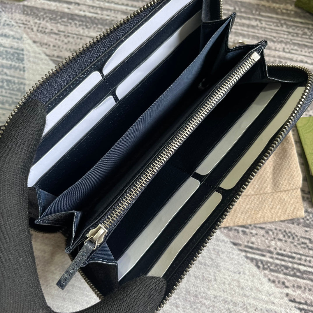 PORTEFEUILLE ZIPPÉ OPHIDIA GG 19 EN TOILE BLEU FONCÉ ET CUIR DE VEAU NOIR