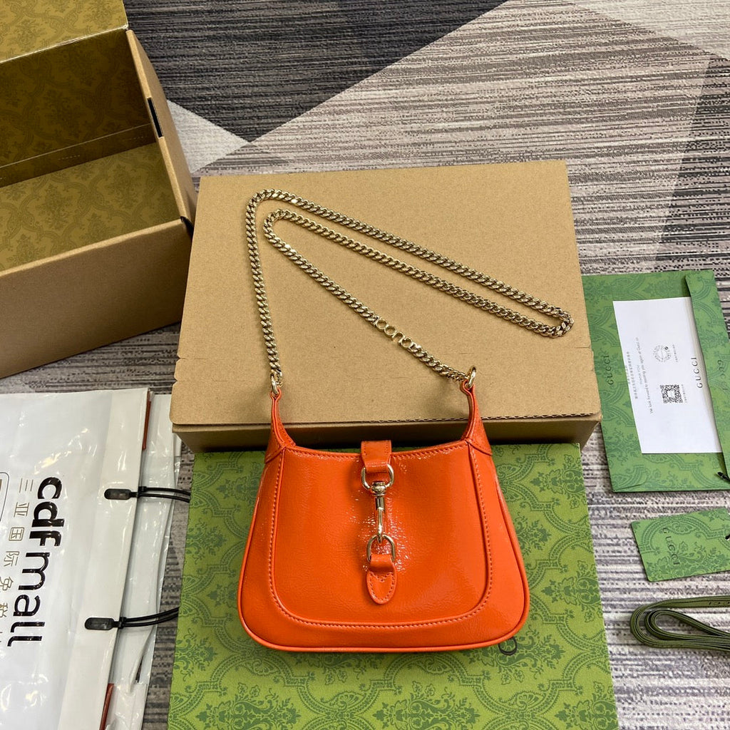 ジャッキー・ノッテ ミニバッグ 19インチ オレンジ クラックラッカーカーフスキン ゴールド金具