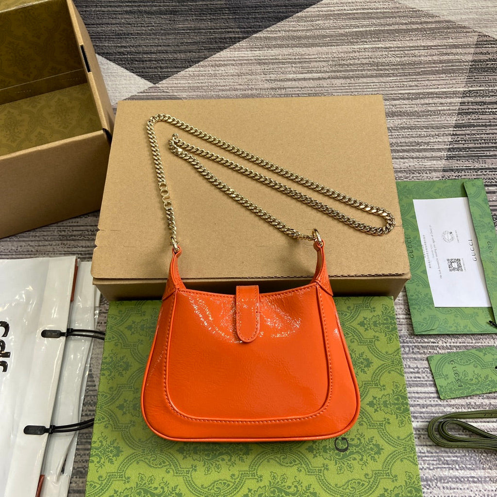 ジャッキー・ノッテ ミニバッグ 19インチ オレンジ クラックラッカーカーフスキン ゴールド金具