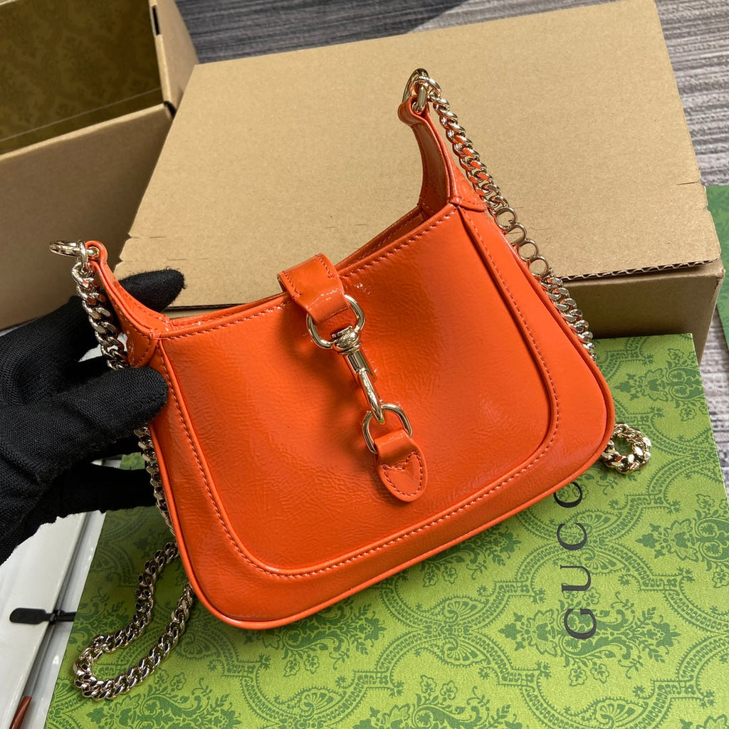 ジャッキー・ノッテ ミニバッグ 19インチ オレンジ クラックラッカーカーフスキン ゴールド金具