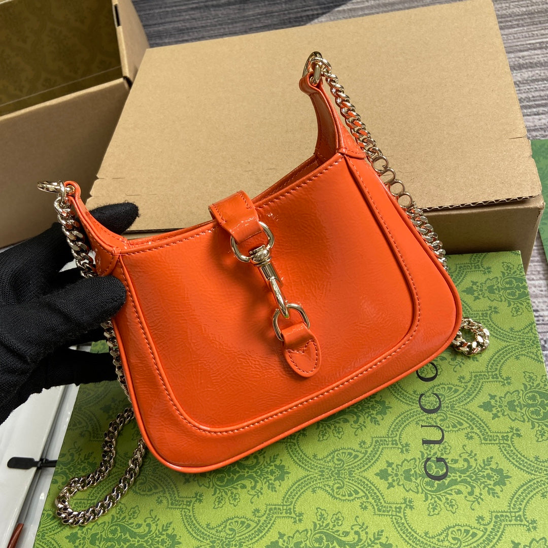 ジャッキー・ノッテ ミニバッグ 19インチ オレンジ クラックラッカーカーフスキン ゴールド金具