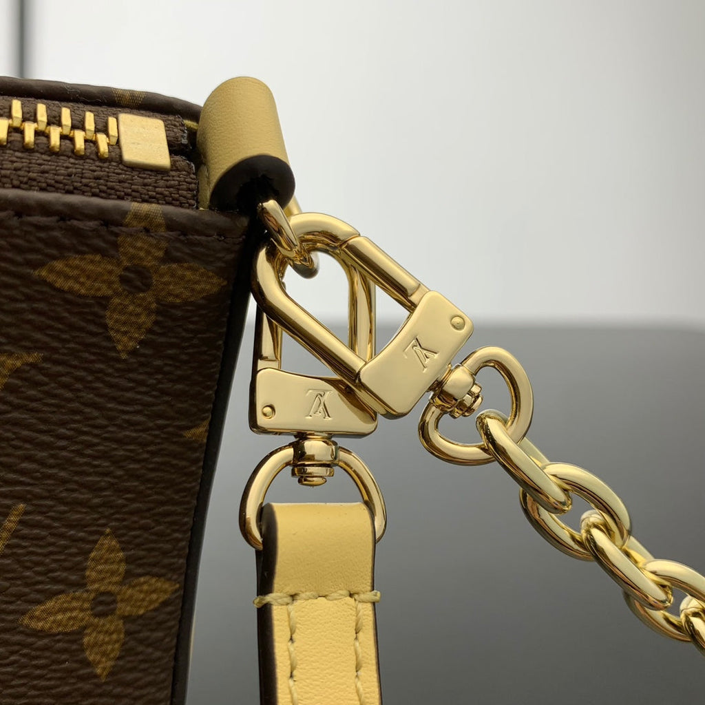Pochette Bloom 22 en toile monogrammée marron et côtés en cuir de veau jaune pastel