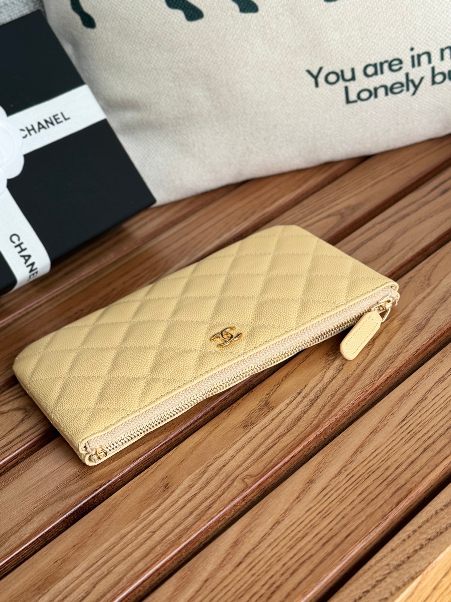 CC ZIPPED WALLET 20CM LIGHT YELLOW QUILTED CAVIAR GOLD HARDWARE
